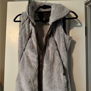 Great vest with a hood in a zipper pocket.